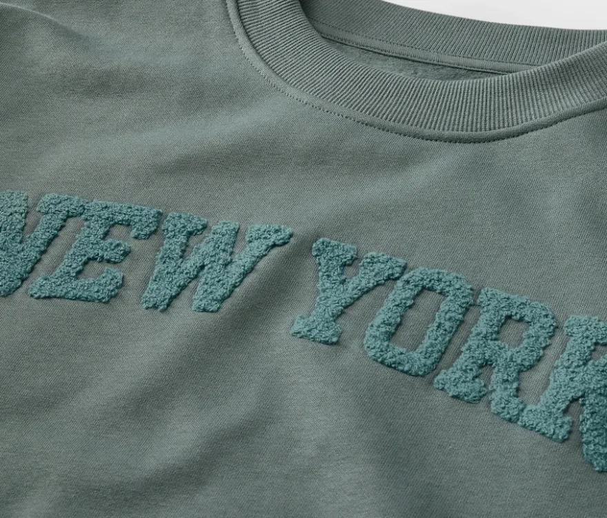 Kinder-Sweatshirt mit Frottee-Schriftzug